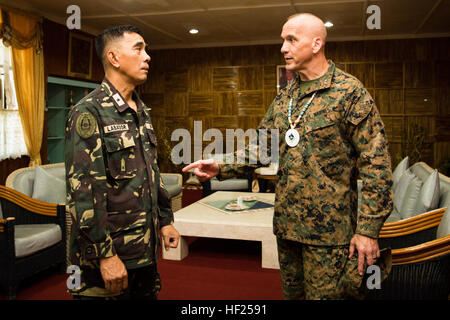 Philippine Brig. Gen. Romeo Labador, deputy commander for operations in Central Command, and Maj. Gen. Richard B. Simcock II, deputy commander of U.S. Marines Corps Forces, Pacific, conduct an office call at Camp Lapu Lapu, Cebu, Philippines, May 13, 2014. The two generals were here to speak at the Urban Search and Rescue training closing ceremony, which focused on techniques needed for USAR missions that arise from natural disasters. The training evolution, as part of Balikatan 2014, aimed at enhancing interoperability and strengthening the Philippine-U.S. relationship. Urban Search and Rescu Stock Photo