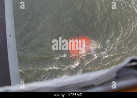 A U.S. Marine Corps CH-53E Super Stallion helicopter, Marine Heavy Helicopter Squadron 462 (HMH-462), Marine Aircraft Group 16, 3rd Marine Aircraft Wing (MAW) collects water in a bambi bucket during aerial firefighting efforts, May 14, 2014. 3rd MAW aircraft partnered with the California Department of Forestry and Fire Protection to conduct aerial firefighting against several wildfires ablaze in San Diego County. (U.S. Marine Corps photo by Staff Sgt. Carl Atherton 3d MAW COMCAM/RELEASED) California Wild Fires 2014 140514-M-OF641-169 Stock Photo