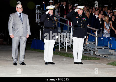 From left, the Evening Parade guest of honor, Bob Parsons; the Evening Parade host, Deputy Commandant for Programs and Resources Lt. Gen. Glenn M. Walters; and the Commanding Officer of Marine Barracks Washington (MBW), Col. Christian G. Cabaniss, stand for honors during the parade at MBW in Washington, D.C., May 16, 2014. The Evening Parades are held every Friday night during the summer months. (U.S. Marine Corps photo by Cpl. Michael C. Guinto/Released) Evening Parade 140516-M-LI307-574 Stock Photo