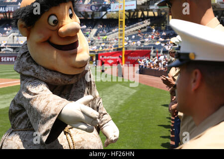 The San Diego Padres mascot, the Swinging Friar, greets Marines and sailors with 3rd Battalion, 4th Marines, 7th Marine Regiment, during their appearance at a military appreciation ceremony at a San Diego Padres baseball game at Petco Park, Sunday. Sailors from the USS San Diego and drill instructors with soon-to-be Marines from Marine Corps Recruit Depot San Diego were also present. E28098DarksideE28099 Marines support community 140525-M-ZM882-599 Stock Photo