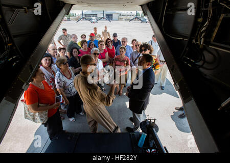 Captain Sean Hulsey, tiltrotar pilot, attached to Special Purpose Marine Air-Ground Task Force-Crisis Response from Marine Medium Tiltrotar Squadron-162, talks about Osprey tiltrotar aircraft capabilities to a local tour group, June 15th, 2014 at Naval Air Station, Sigonella, Italy.  For the tour, Special Purpose Marine Air-Ground Task Force (SPMAGTF)-Africa and SPMAGTF -Crisis Response showcased their 7-ton trucks, Explosive Ordnance Disposal (EOD) bomb suits, EOD robots, MV-22 Ospreys and KC-130s.  (Official Marine Corps photo by Staff Sgt. Tanner M. Iskra, SPMAGTF-AF, 2nd Marine Division Co Stock Photo