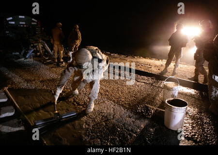 081101-M-0153W-063 LAKE HABBANIYAH, Iraq (Nov. 1, 2008) Marines assigned to the 9th Engineer Support Battalion (ESB) of the 1st Naval Construction Regiment repair potholes during a route repair mission near Lake Habbaniyah. The  mission of the 9th ESB is to improve road conditions for Iraqis and coalition forces in support of Operation Iraqi Freedom. (U.S. Marine Corps photo by Sgt. James D. Wilkins/Released) US Navy 081101-M-0153W-063 Marines assigned to the 9th Engineer Support Battalion (ESB) of the 1st Naval Construction Regiment repair potholes during a route repair mission near Lake Habb Stock Photo