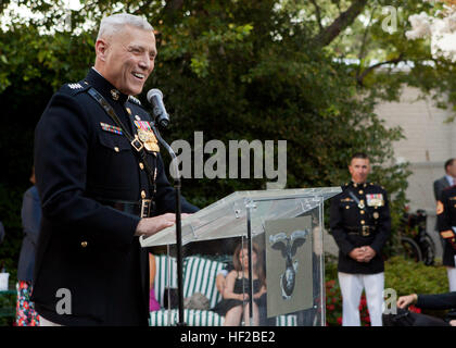 The Evening Parade host, the Assistant Commandant of the Marine Corps, Gen. John M. Paxton, Jr., gives an address during the parade reception at the Home of the Commandants in Washington, D.C., July 25, 2014. The Evening Parades are held every Friday night during the summer months. (U.S. Marines Corps photo by Cpl. Tia Dufour/Released) Evening Parade 140725-M-KS211-021 Stock Photo