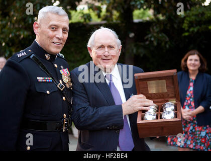 The Evening Parade host, the Assistant Commandant of the Marine Corps, Gen. John M. Paxton, Jr., left, poses for a photo with the parade guest of honor, Michigan Sen. Carl M. Levin, during the parade reception at the Home of the Commandants in Washington, D.C., July 25, 2014. The Evening Parades are held every Friday night during the summer months. (U.S. Marines Corps photo by Cpl. Tia Dufour/Released) Evening Parade 140725-M-KS211-031 Stock Photo