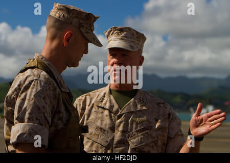 U.S. Marine Corps Gen. James F. Amos, commandant of the Marine Corps and Sgt. Maj. William T. Stables, U.S. Marine Corps Forces, Pacific, discuss the sequence of events before the U.S. Marine Corps Forces, Pacific change of command ceremony on Marine Corps Base Hawaii, August 15, 2014. Lt. Gen. John A. Toolan Jr. assumed command from Lt. Gen. Terry G. Robling during the ceremony. (U.S. Marine Corps photo by Lance Cpl. Wesley Timm/Released) MARFORPAC Change of Command Ceremony 140815-M-AR450-002 Stock Photo