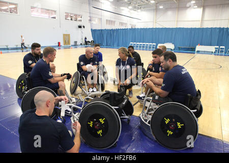 The US Team of wounded, ill, or injured service members from multiple branches, including Marines, trains in wheelchair rugby for the 2014 Invictus Games in London, enhancing skills and teamwork before the competition. Stock Photo