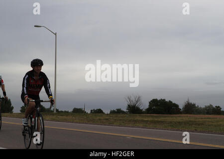 A Marine paces during cycling practice on Sept. 22, 2014, at the 2014 Warrior Games camp in Colorado Springs, Colorado. The Marine team, consisting of active duty and veteran wounded, ill, and injured personnel supported by the Wounded Warrior Regiment, trains to build cohesion, endurance, and acclimate to high-altitude conditions above 6,000 feet. Stock Photo