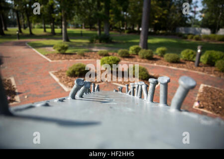 At the intersection of Lejeune Boulevard and Montford Landing Road in Jacksonville, is a place where the people in Jacksonville and Marine Corps Base Camp Lejeune come together to remember and reflect on events that affected the community at large. At Lejeune Memorial Gardens, visitors can view monuments memorializing the Vietnam War, the 1983 bombings of the barracks in Beirut and the attacks on the World Trade Center on Sept. 11, 2001. Lejeune Memorial Gardens, A place to reflect 141002-M-IY869-072 Stock Photo