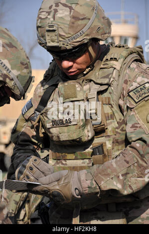 U.S. Army Spc. Marion A. Douglas, a gunner for 2nd Platoon, Alpha Company, 2nd Battalion, 162nd Infantry, 41st Infantry Brigade Combat Team, Oregon Army National Guard completes a Tactical Combat Casualty Card (TCCC) during a training exercise in Kabul, Afghanistan, Oct. 24, 2014. The TCCC documents medical intervention by those Soldiers who first respond at the point of injury. Information from the cards can be critical in ensuring adequate future care for those injured on the battlefield. (U.S. Army National Guard photo by Capt. Leslie Reed/Released) Oregon Soldiers complete medical training Stock Photo