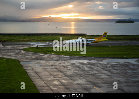 An aircraft operated by Cebu Pacific Air lands during the early morning hours at Daniel Z. Romualdez Airport in Tacloban, Leyte, Philippines, Nov. 16, 2014. The airport was overwhelmingly damaged during Typhoon Yolanda on Nov. 8, 2013, but quickly re-opened three days after the storm through the relief efforts of Operation Damayan. (U.S. Marine Corps photo by MCIPAC Combat Camera Staff Sgt. Jeffrey D. Anderson/ Released) Commemoration of Op Damayan, 2014 141116-M-WN441-111 Stock Photo