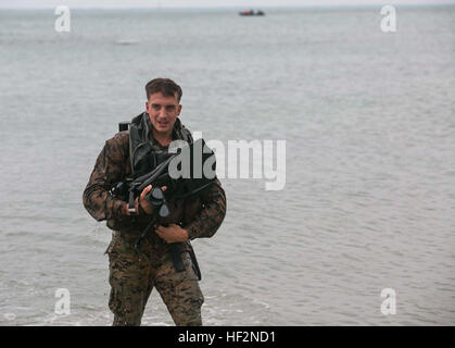 Marine assigned to 3rd Reconnaissance Battalion coaches a Mongolian ...
