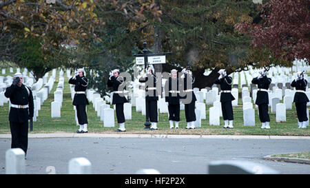 The Navy Honor Guard fires a volley as part of the 21-gun salute in honor of Capt. Eli Takesian, the eighth Chaplain of the Marine Corps, at the Arlington National Cemetery, Arlington, Va., on Dec. 4, 2014. Takesian died May 20, 2014, at the Walter Reed National Military Medical Center in Bethesda, Md. Takesian is most renowned for the care and aid he provided to the Marines of 1st Battalion, 5th Marine Regiment at the bloody battle of Hue City during the Vietnam War. Serving Sea Services, Eighth chaplain of the Marine Corps laid to rest in Arlington National Cemetery 141204-M-SE090-001 Stock Photo