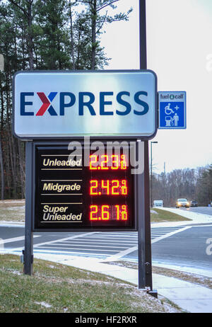 This photo, taken Jan. 14, 2015, at the Fort Belvoir, Va., Express, shows the blue FuelCall sign, which indicates the gas pumps are equipped with a new call button system that allows drivers with disabilities to request assistance from a store associate with refueling. The Department of Defense authorized $1.12 million to install FuelCall assistance systems at military service stations on 370 Army, Air Force, Navy and Marine Corps installations worldwide. (Photo by Frank Marquez / Army & Air Force Exchange Service) Army & Air Force Exchange Service offers full-service refueling to drivers with Stock Photo