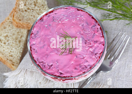 Salad 'Herring under a fur coat'  in a glass bowl Stock Photo