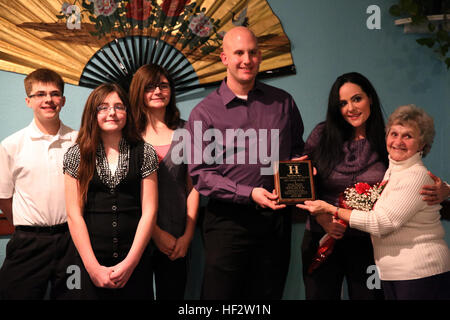 The family of Lance Cpl. Zachary Davidson pose for a picture after being honored as the Havelock Military Affairs Committee Military Family of the Quarter during a dinner in Havelock, N.C., Jan. 27, 2015. The Davidson family was recognized for their dedication to serving the community. Davidson is a military police officer with Headquarters and Headquarters Squadron at Marine Corps Air Station Cherry Point, N.C., and a native of Memphis, Tenn. Marine, Family of Quarter 150127-M-RH401-434 Stock Photo