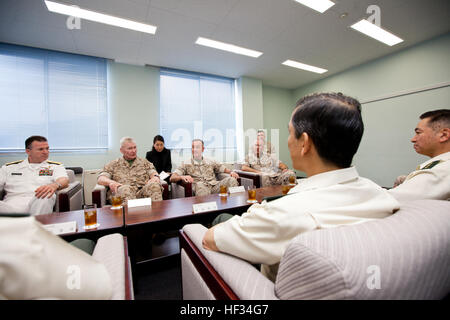 U.S. Marines Lt. Gen. John A. Toolan, center left, the commanding general for Marine Forces Pacific, Commandant of the Marine Corps Gen. Joseph F. Dunford Jr., center right, and Maj. Gen. Charles L. Hudson, right, the commanding general of Marine Corps Installations Pacific, top right, meet with Japan Gen. Kiyofumi Iwata, the chief of staff of the Japan Ground Self-Defense Force, before the Reunion of Honor ceremony at Iwo To, Japan, March 21, 2015. Iwo Jima veterans, families, Marines, Japanese troops and officials attended the ceremony commemorating the lives of those lost in one of the most Stock Photo