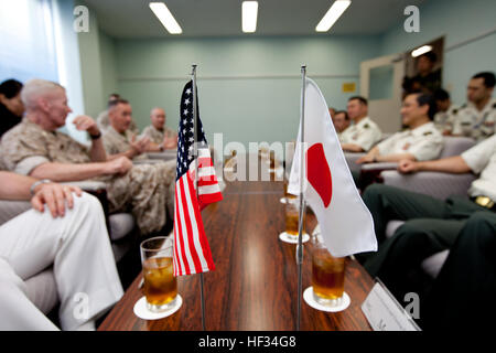 U.S. Marine Lt. Gen. John A. Toolan, left, the commanding general for Marine Forces Pacific, Commandant of the Marine Corps Gen. Joseph F. Dunford Jr., center left, and Maj. Gen. Charles L. Hudson, back left, the commanding general of Marine Corps Installations Pacific, top right, meet with to Japan Gen. Kiyofumi Iwata, center right, the chief of staff of the Japan Ground Self-Defense Force before the Reunion of Honor ceremony at Iwo To, Japan, March 21, 2015. Iwo Jima veterans, families, Marines, Japanese troops and officials attended the ceremony commemorating the lives of those lost in one  Stock Photo