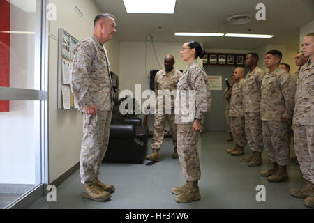 Gen. Joseph Dunford, Commandant of the Marine Corps, and Sgt. Maj. Ronald Green, Sergeant Major of the Marine Corps, paid a visit to the service members aboard Marine Corps Air Station Iwakuni, Japan, March 24, 2015. During their visit, Dunford and Green conducted an all-hands brief and toured some of the units aboard station including Marine All-Weather Fighter Attack Squadron 242 and Marine Aviation Logistics Squadron 12. Dunford also spoke to service members about the issues pertaining to the current state of the Marine Corps and his plans to improve it while fielding questions the service  Stock Photo