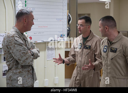 Gen. Joseph Dunford, Commandant of the Marine Corps, and Sgt. Maj. Ronald Green, Sergeant Major of the Marine Corps, paid a visit to the service members aboard Marine Corps Air Station Iwakuni, Japan, March 24, 2015. During their visit, Dunford and Green conducted an all-hands brief and toured some of the units aboard station including Marine All-Weather Fighter Attack Squadron 242 and Marine Aviation Logistics Squadron 12. Dunford also spoke to service members about the issues pertaining to the current state of the Marine Corps and his plans to improve it while fielding questions the service  Stock Photo