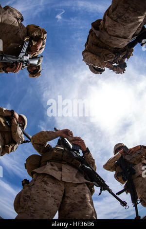 U.S. Marines assigned to Marine Wing Support Squadron (MWSS) 271, prepare to conduct a defense of an expeditionary airfield (DEAF) exercise during Weapons and Tactics Instructor Course (WTI) 2-15 at Landing Zone Bull at Chocolate Mountain Aerial Gunnery Range, Calif., April 10, 2015. WTI is a seven-week event hosted by Marine Aviation Weapons and Tactics Squadron One (MAWTS-1) cadre. MAWTS-1 provides standardized tactical training and certification of unit instructor qualifications to support Marine aviation Training and Readiness and assists in developing and employing aviation weapons and ta Stock Photo