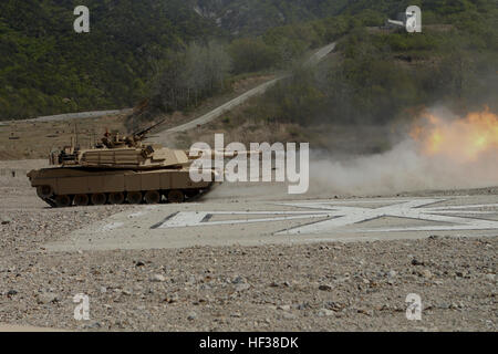 Marines with Company A, 4th Tank Battalion, 4th Marine Division, Marine Forces Reserve fire the main guns of their M1A1 Abrams tanks April 25 at Suseong-ri Firing Range. The live-fire was conducted as part of Korean Marine Exchange Program 13-7, which is one of three KMEPs taking place during the exercise Ssang Yong 13. Ssang Yong, which means 'twin dragons,' is an annual exercise designed to enhance the interoperability of both ROK and U.S. forces.  (Marine Corps photo by Lance Cpl. Donald T. Peterson/Released) ROK, US Marines conduct bilateral tank shoot 130424-M-GE767-001 Stock Photo