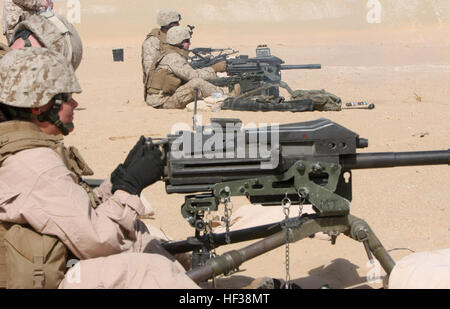 Pfc. Alexia L. Mauro, a heavy equipment operator with Combat Logistics Battalion 22, 22nd Marine Expeditionary Unit, blasts training rounds down range with a MK-19 40mm automatic grenade launcher during a machine gun shoot at a training area near Camp Buehring, Kuwait, Aug. 13. The 22nd MEU is ashore conducting sustainment training in Kuwait and is currently serving as the theater reserve force for U.S. Central Command. Combat Logistics Battalion-22 Marines get back to their rifleman roots with live fire DVIDS195266 Stock Photo