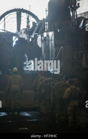 Marines with the 24th Marine Expeditionary Unit prepare to board a landing craft air cushion, in the well deck of the amphibious transport dock ship USS New York (LPD 21) in order to participate in bilateral training with the French, May 6, 2015,. The 24th MEU is embarked on the ships of the Iwo Jima Amphibious Ready Group, and is deployed to maintain regional security in the U.S. 5th Fleet area of operations. (U.S. Marine Corps photo by Cpl. Todd F. Michalek/Released) US Marines train alongside French Armed Forces in Djibouti 150506-M-YH418-007 Stock Photo