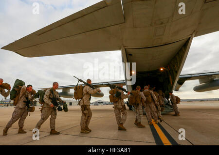 U.S. Marines with India Company, Battalion Landing Team 3rd Battalion, 1st Marine Regiment, 15th Marine Expeditionary Unit board a KC-130J Hercules aboard Marine Corps Air Station Miramar, Calif., May 13, 2015. The Marines of BLT 3/1 head to Hawaii for sustainment training before boarding the USS Anchorage (LPD-23) for their deployment through the Pacific and Central Command area. (U.S. Marine Corps photo by Sgt. Jamean Berry/Released) Leaving on a jet plane, 3-1 Marines depart for Hawaii 150513-M-GC438-023 Stock Photo