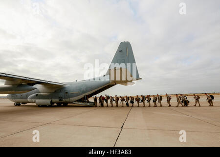 U.S. Marines with India Company, Battalion Landing Team 3rd Battalion, 1st Marine Regiment, 15th Marine Expeditionary Unit, board a KC-130J Hercules aboard Marine Corps Air Station Miramar, Calif., May 13, 2015. The Marines of BLT 3/1 head to Hawaii for sustainment training before boarding the USS Anchorage (LPD-23) for their deployment through the Pacific and Central Command area. (U.S. Marine Corps photo by Sgt. Jamean Berry/Released) Leaving on a jet plane, 3-1 Marines depart for Hawaii 150513-M-GC438-047 Stock Photo