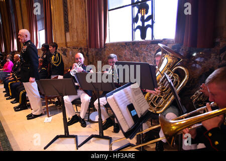 The Brass Quintet of Marine Corps Band New Orleans plays the Marine Corps hymn while Lt. Gen. Richard P. Mills, commander of Marine Forces Reserve stands at attention during a Memorial Day ceremony on the floor of the Louisiana House of Representatives at the state capital in Baton Rouge, Louisiana, May 21, 2015. The House held a ceremony with Lt. Gen. Richard P. Mills, commander of Marine Forces Reserve and other senior leaders from service branches in the local area to commemorate those who lost their lives in battle for the country. A day of remembrance, Where all gave some, some gave all.  Stock Photo