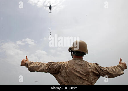 150528-M-QZ288-035: GULF OF ADEN (May 28, 2015) Reconnaissance Marines with the 24th Marine Expeditionary Unit’s Maritime Raid Force, sourced from Force Reconnaissance Company, 2nd Reconnaissance Battalion, conduct special patrol insertion/extraction training from a UH-1Y Huey aboard the amphibious assault ship USS Iwo Jima (LHD 7) in the Gulf of Aden, May 28, 2015. The Huey belongs to Marine Medium Tiltrotor Squadron 365 (Reinforced), 24th MEU. The 24th MEU is embarked on the Iwo Jima Amphibious Ready Group and deployed to maintain regional security in the U.S. 5th Fleet area of operations. ( Stock Photo