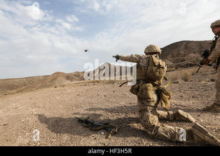 ARTA BEACH, Djibouti (July 22, 2015) U.S. Marine Lance Cpl. Spencer Feikert throws a practice grenade during a grenade accuracy exercise. Feikert is a rifleman with Battalion Landing Team 3rd Battalion, 1st Marine Regiment, 15th Marine Expeditionary Unit.  Elements of the 15th Marine Expeditionary Unit are ashore in Djibouti for sustainment training to maintain and enhance the skills they developed during their pre-deployment training period.  The 15th MEU is currently deployed in support of maritime security operations and theater security cooperation efforts in the U.S. 5th and 6th Fleet are Stock Photo