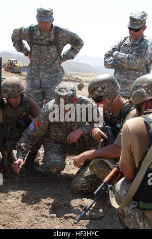 A small group of Kansas National Guardsmen assist and advise Soldiers with the Armenian Peacekeeping Brigade at the Zar Mountain Training Center, near Yerevan, Armenia, July 27 - Aug. 7, 2015, in preparation of a major NATO evaluation in September 2015. The combat readiness evaluation will be a culmination of a years-long process that would certify the interoperability of the Armenian PKB in support of NATO peacekeeping operations. Kansas and Armenia have been partnered in the National Guard Bureau's State Partnership Program since 2003. (U.S. Army National Guard photo by Sgt. Zach Sheely/Rele Stock Photo