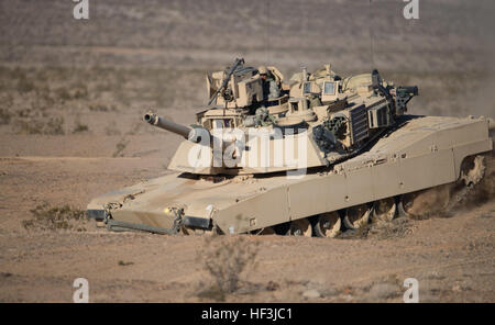 An M1A2 Abrams tank from D Company, 3rd Battalion, 116th Cavalry Brigade Combat Team (CBCT), Oregon Army National Guard, maneuvers toward an obstacle breach during a company live fire exercise, Aug. 16, at the National Training Center, Fort Irwin, Calif. The 116th CBCT is participating in battle simulation scenarios composed of more than 5,200 Soldiers with National Guard units from 10 states, the U.S. Army Reserve and active duty U.S Army Soldiers. (Photo by Maj. W. Chris Clyne, 115th Mobile Public Affairs Detachment) National Guard conducts live fire at NTC 150816-Z-ZJ128-006 Stock Photo