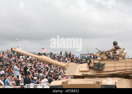 U.S. Marines ride in an M1-A1 Abrams Tank during the Marine Air-Ground Task Force demonstration during the Marine Corps Community Services sponsored 2015 Air Show on Marine Corps Air Station Miramar, San Diego, Calif., Oct. 4, 2015. The air show showcases civilian performances and the aerial prowess of the armed forces and their appreciation of the civilian community's support and dedication to the troops. (U.S. Marine Corps Combat Camera photo by Cpl. Allison J. Herman/Released) 2015 MCCS Miramar Air Show MAGTF Demonstration 151004-M-DF987-317 Stock Photo