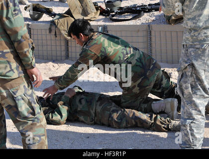An Afghan national army soldier demonstrates rescue procedures during the Afghan national security forces legion academy at Forward Operating Base Ramrod, Afghanistan, Dec. 15, 2009. The purpose of the academy is to train ANSF various field tactics to support their day-to-day operations. (U.S. Air Force photo by Staff Sgt. Dayton Mitchell/Released) FOB Ramrod troops emplace and fire M-777 105 mm howitzer DVIDS232785 Stock Photo