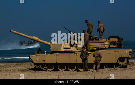 Marines with Delta Company, 1st Tank Battalion conduct rail operations at Dogu Beach, South Korea, on March 15, 2016, as part of Exercise Ssang Yong 16. Ssang Yong 16 is a biennial combined amphibious exercise conducted by forward-deployed U.S. forces with the Republic of Korea Navy and Marine Corps, Australian Army and Royal New Zealand Army Forces in order to strengthen our interoperability and working relationships across a wide range of military operations - from disaster relief to complex expeditionary operations. Tanks roll up on Dogu Beach 160315-M-XX123-264 Stock Photo