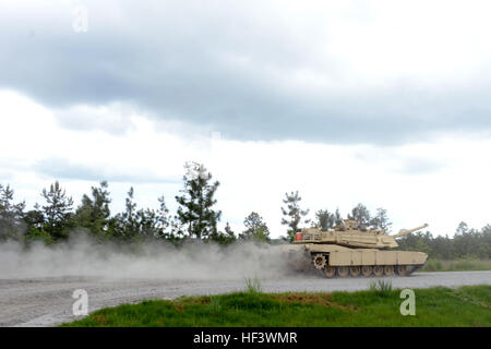 Members of a tank crew with the Tennessee Army National Guard’s H Troop, 2nd Squadron, 278th Armored Cavalry Regiment kick up dust as they race against the clock to their next land navigation point on an M1A1 Abrams tank while competing in the Gen. Gordon Sullivan Cup best tank crew competition at Fort Benning, Ga., Tuesday, May 3, 2016. The Sullivan Cup tests tank crews from throughout the Army on everything from gunnery to mounted land navigation, maintenance and combat casualty care in a variety of physically and mentally challenges setting to determine the Army’s best tank crew. (U.S. Army Stock Photo