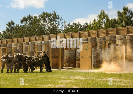 U.S. Marines 2nd Combat Engineer Battalion, 2nd Marine Division (2D MARDIV), detonate a wall breeching explosive during a live breeching exercise at Camp Lejeune, N.C, April 5, 2016.  The Marines participated in a Marine Corps Combat Readiness Evaluation, to build core proficiency, improve combat readiness, and to better prepare for combat scenarios. (U.S. Marine Corps photo by Lance Cpl. Melanye E. Martinez, 2D MARDIV/Released) 2nd CEB MCRE 160405-M-MS784-053 Stock Photo