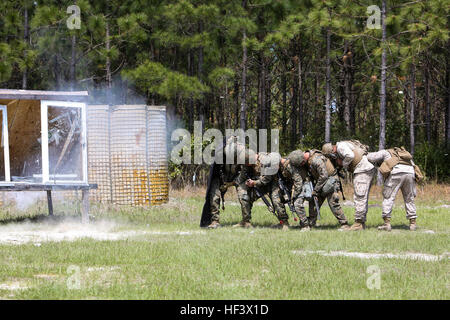 U.S. Marines 2nd Combat Engineer Battalion, 2nd Marine Division (2D MARDIV), detonate a wall breeching explosive during a live breeching exercise at Camp Lejeune, N.C, April 5, 2016.  The Marines participated in a Marine Corps Combat Readiness Evaluation, to build core proficiency, improve combat readiness, and to better prepare for combat scenarios. (U.S. Marine Corps photo by Lance Cpl. Melanye E. Martinez, 2D MARDIV/Released) 2nd CEB MCRE 160405-M-MS784-083 Stock Photo