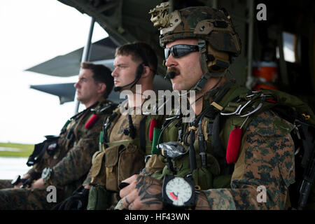 Marines assigned to Force Reconnaissance Platoon, Maritime Raid Force, 31st Marine Expeditionary Unit, await to conduct a high altitude low opening jump as part of Exercise Valiant Shield, on Andersen Air Force Base, Guam, Sept. 17, 2016. The Force Reconnaissance Marines conducted the HALO jump to insert and conduct reconnaissance of the area in preparation for follow on operations in the exercise. A HALO jump involves the parachutist jumping from a high altitude and opening their parachute at a low altitude. Valiant Shield is a biennial, U.S. only field-training exercise with a focus on integ Stock Photo