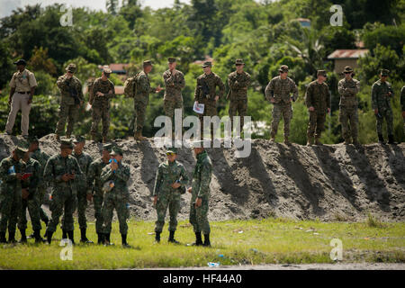 U.S. and Philippine Marines survey training space during Philippine Amphibious Landing Exercise 33 (PHIBLEX) at Colonel Ernesto Ravina Air Base, Philippines, Oct. 5, 2016. PHIBLEX is an annual U.S.-Philippine military bilateral exercise that combines amphibious capabilities and live-fire training with humanitarian civic assistance efforts to strengthen interoperability and working relationships. The U.S. Marines are with Echo Company, 2nd Battalion, 4th Marine Regiment, attached to the 31st Marine Expeditionary Unit, III Marine Expeditionary Force. (U.S. Marine Corps photo by Cpl. Steven Tran/ Stock Photo