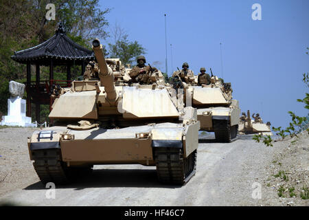 Marines with Company A, 4th Tank Battalion, 4th Marine Division, Marine Forces Reserve convoy from 1st Republic of Korea Marine Division Base to Suseong-ri Firing Range April 22. The convoy was conducted as part of Korean Marine Exchange Program 13-7, which is one of three KMEPs taking place during the exercise Ssang Yong 13. Ssang Yong, which means 'twin dragons,' is an annual exercise designed to enhance the interoperability of both ROK and U.S. forces. (Marine Corps photo by Lance Cpl. Donald T. Peterson/Released) ROK, US Marines conduct bilateral tank shoot 130422-M-GE767-001 Stock Photo