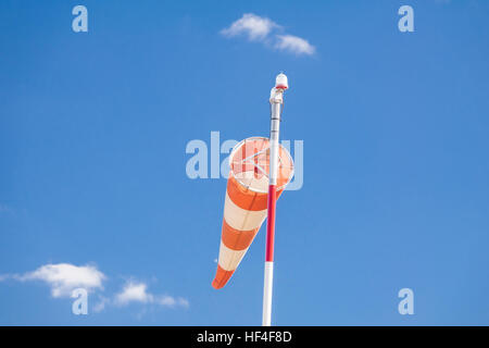 Airfield windsock, used to indicate wind speed and direction, shown ...