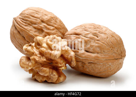 Peeled walnut and its kernels. Isolated on a white background Stock Photo