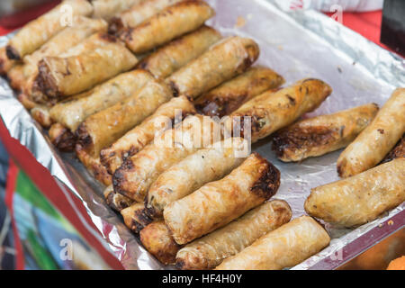 Street food -  spring rolls ready for sale at the market Stock Photo