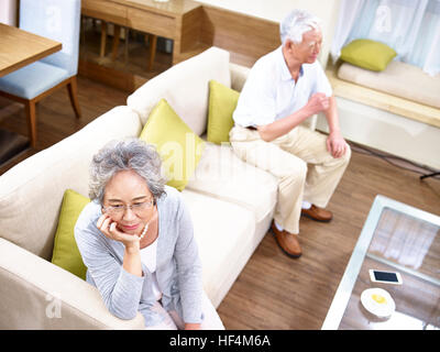 senior asian couple having relationship problem angry with each other, high angle view. Stock Photo