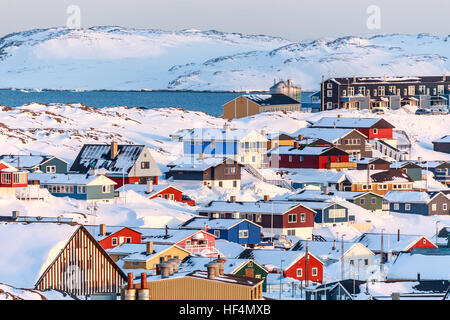 Nuuk city covered in snow with sea and mountains in the background, Greenland Stock Photo