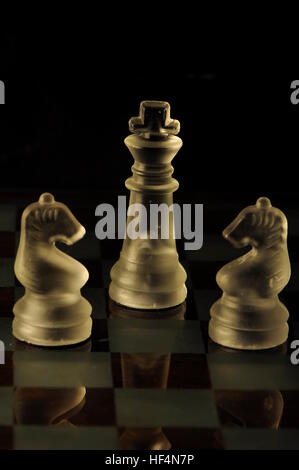 Chess glass pieces on a marble  board Stock Photo