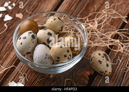 fresh quail eggs on the wooden table Stock Photo